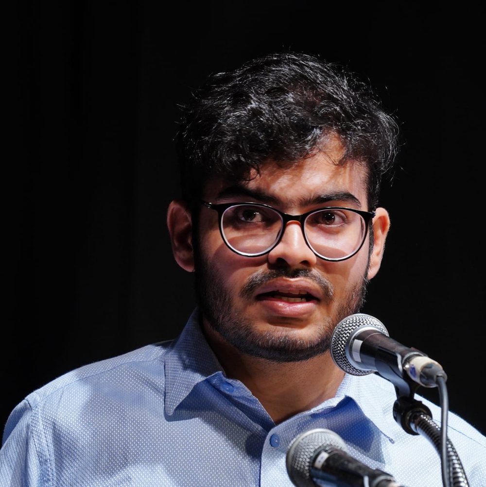 Neel Madhav speaking at an event
